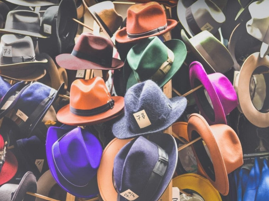 Wall of colorful felt fedoras at Hatman Jack's
